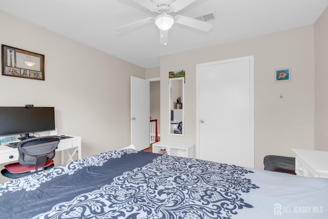 bedroom featuring visible vents and ceiling fan