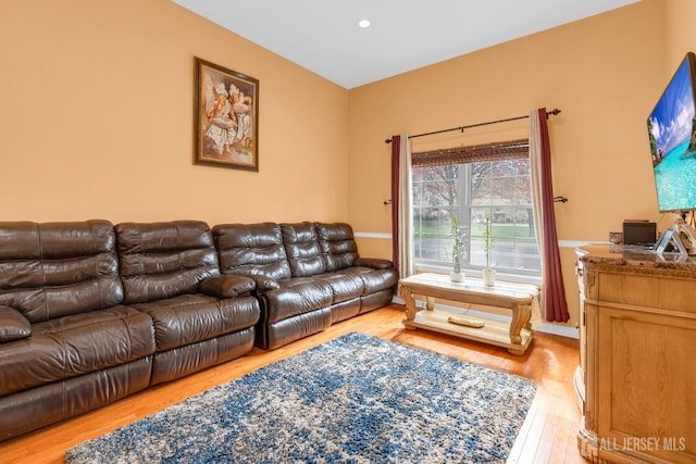living room with recessed lighting and light wood-style floors