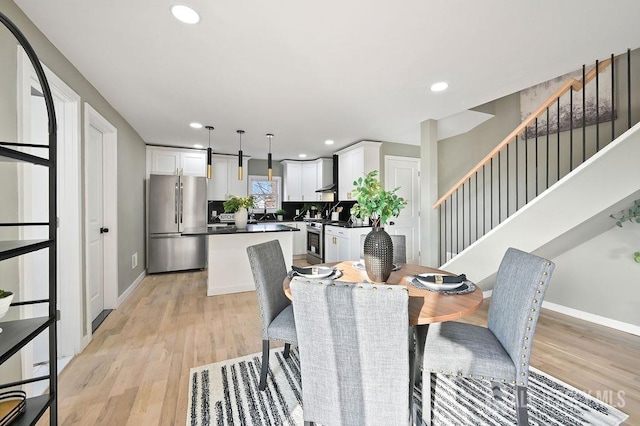 15 Clausen Ln, Sayreville, NJ 08872 - dining room featuring stairway, light wood finished floors, and recessed lighting