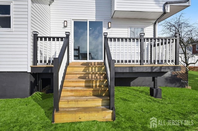 15 Clausen Ln, Sayreville, NJ 08872 - doorway to property featuring a wooden deck and a lawn