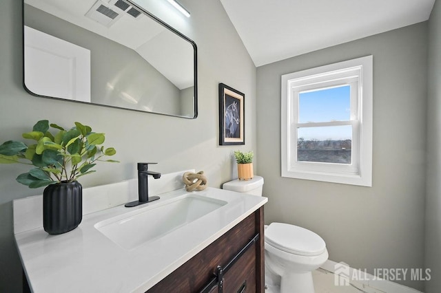 15 Clausen Ln, Sayreville, NJ 08872 - half bathroom featuring vanity and lofted ceiling