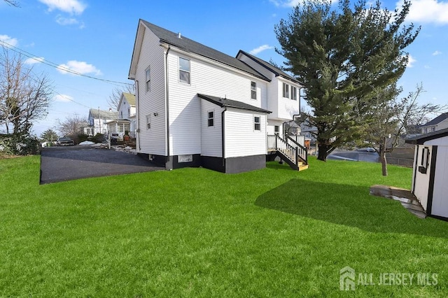 15 Clausen Ln, Sayreville, NJ 08872 - back of property featuring a lawn