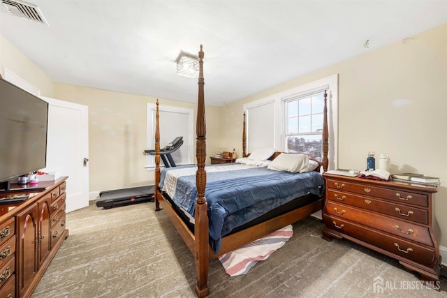 bedroom featuring light colored carpet