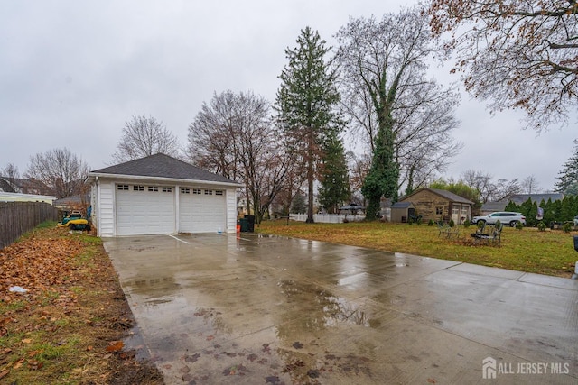 garage featuring a yard