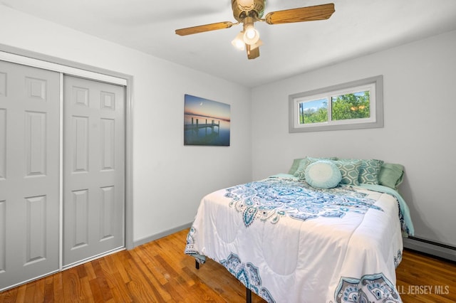 13 Orchard Pkwy, Morganville, NJ 07751 - bedroom with wood finished floors, baseboards, a closet, and a ceiling fan