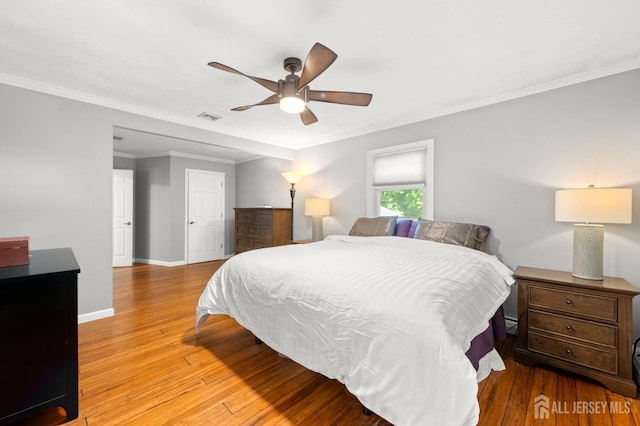 13 Orchard Pkwy, Morganville, NJ 07751 - bedroom with light wood finished floors, baseboards, crown molding, a baseboard heating unit, and a ceiling fan