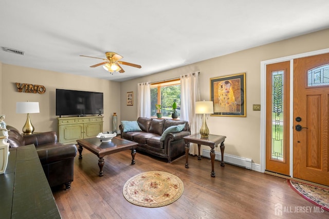 13 Orchard Pkwy, Morganville, NJ 07751 - living area featuring a ceiling fan, wood finished floors, a baseboard radiator, and baseboards