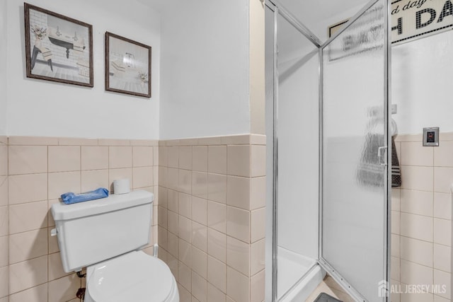 750 Barry Ave, Perth Amboy, NJ 08861 - full bath with toilet, a stall shower, tile walls, and a wainscoted wall