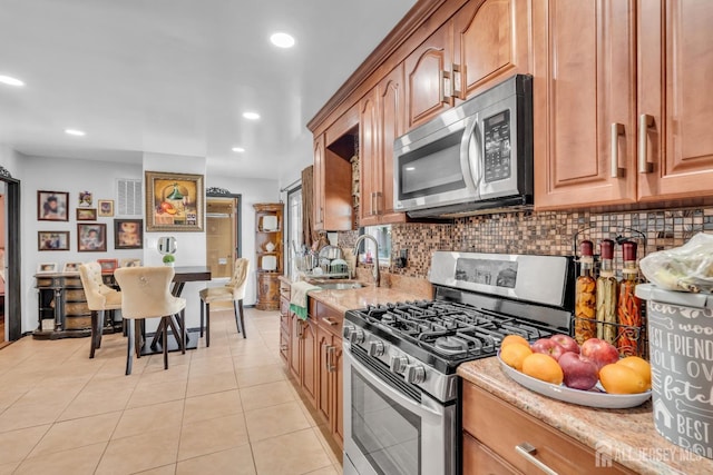 750 Barry Ave, Perth Amboy, NJ 08861 - kitchen featuring stainless steel appliances, a sink, tasteful backsplash, recessed lighting, and light tile patterned floors