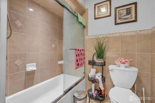 750 Barry Ave, Perth Amboy, NJ 08861 - full bathroom with toilet, tile walls, and combined bath / shower with glass door