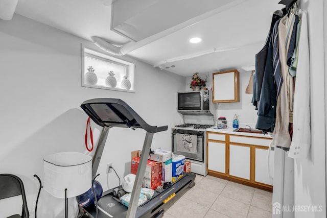 750 Barry Ave, Perth Amboy, NJ 08861 - workout area featuring recessed lighting, a sink, and light tile patterned floors