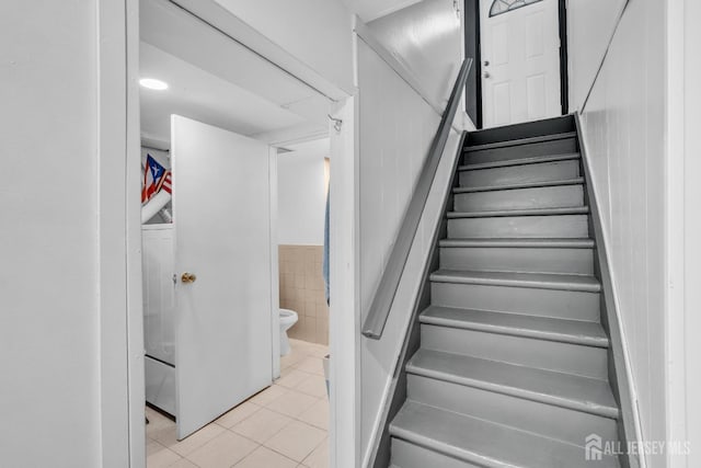 750 Barry Ave, Perth Amboy, NJ 08861 - staircase featuring tile patterned floors and tile walls