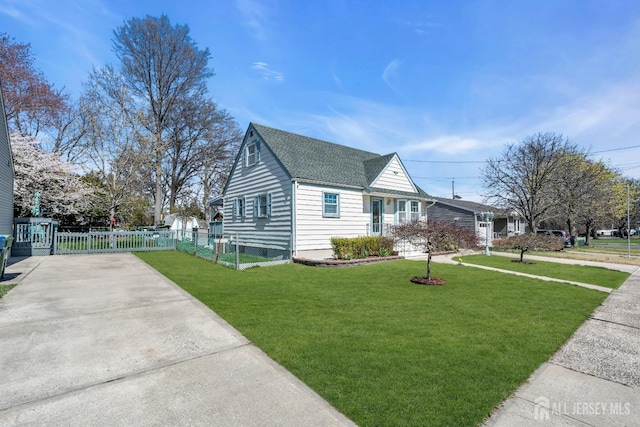 750 Barry Ave, Perth Amboy, NJ 08861 - view of side of home with fence, roof with shingles, a yard, and concrete driveway