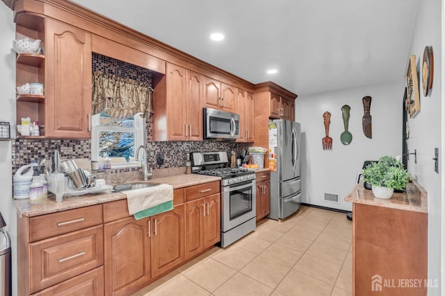 750 Barry Ave, Perth Amboy, NJ 08861 - kitchen with visible vents, decorative backsplash, light stone counters, open shelves, and appliances with stainless steel finishes