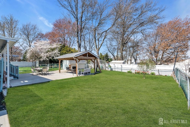 750 Barry Ave, Perth Amboy, NJ 08861 - view of yard featuring a gazebo, a patio, and a fenced backyard