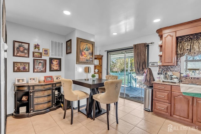 750 Barry Ave, Perth Amboy, NJ 08861 - dining area with recessed lighting and light tile patterned flooring