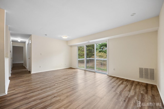 unfurnished room featuring wood-type flooring