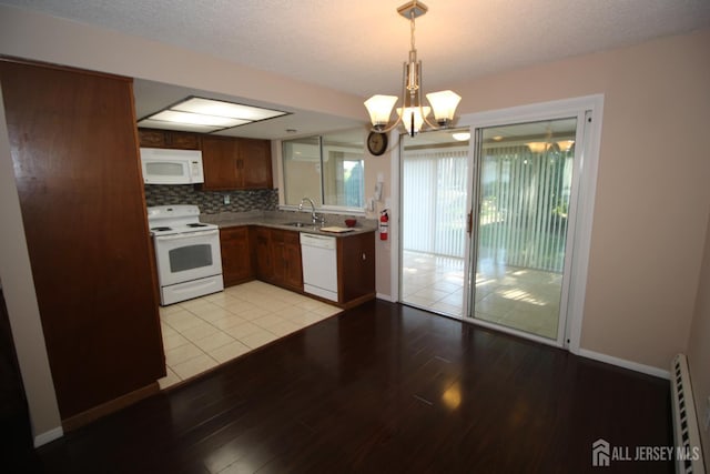 236-A Vernon Rd, Monroe, NJ 08831 - kitchen featuring white appliances, a chandelier, light wood-style flooring, decorative light fixtures, and light countertops
