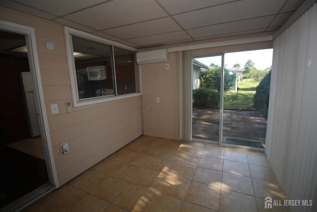 236-A Vernon Rd, Monroe, NJ 08831 - spare room featuring a wall unit AC, a drop ceiling, and light tile patterned floors