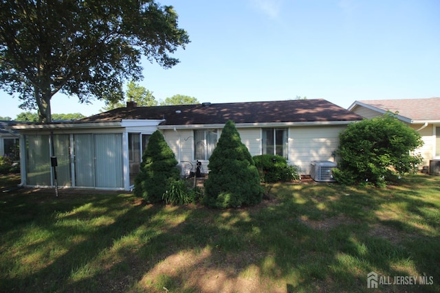 236-A Vernon Rd, Monroe, NJ 08831 - back of property with a lawn and a sunroom