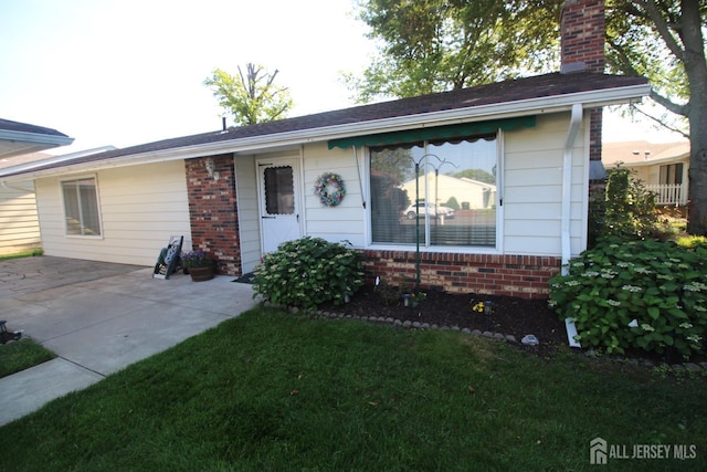 236-A Vernon Rd, Monroe, NJ 08831 - ranch-style house featuring brick siding, a chimney, and a patio