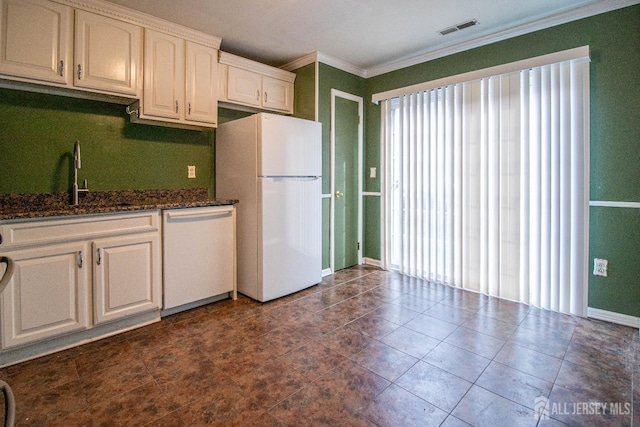 8 Starlight Ct, New Brunswick, NJ 08901 - kitchen with freestanding refrigerator, dishwashing machine, ornamental molding, dark stone countertops, and white cabinets
