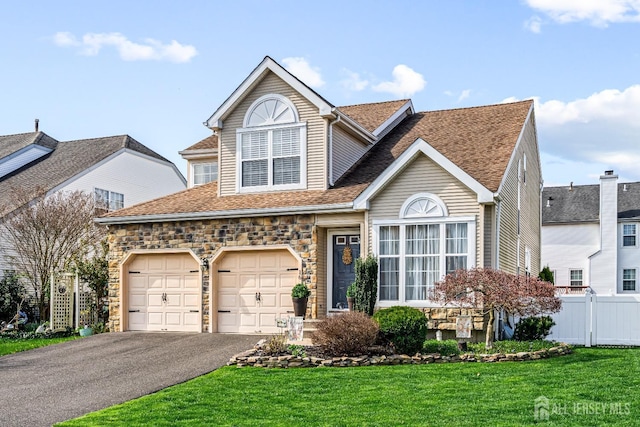 16 Dryden Dr, Burlington Twp, NJ 08016 - view of front of property featuring asphalt driveway, stone siding, roof with shingles, and an attached garage