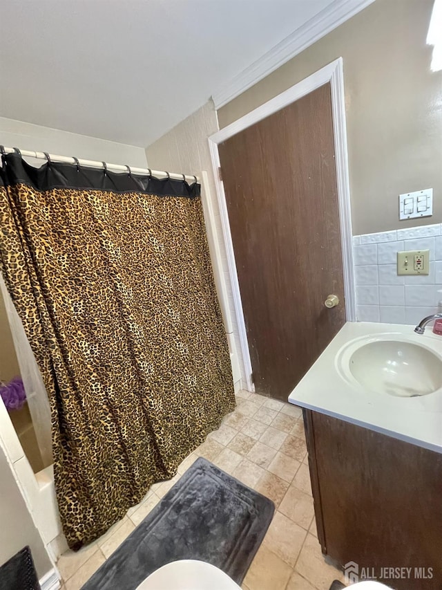 1211 S 9th St, South Plainfield, NJ 07080 - bathroom with vanity, ornamental molding, tile patterned floors, shower / bathtub combination with curtain, and tile walls