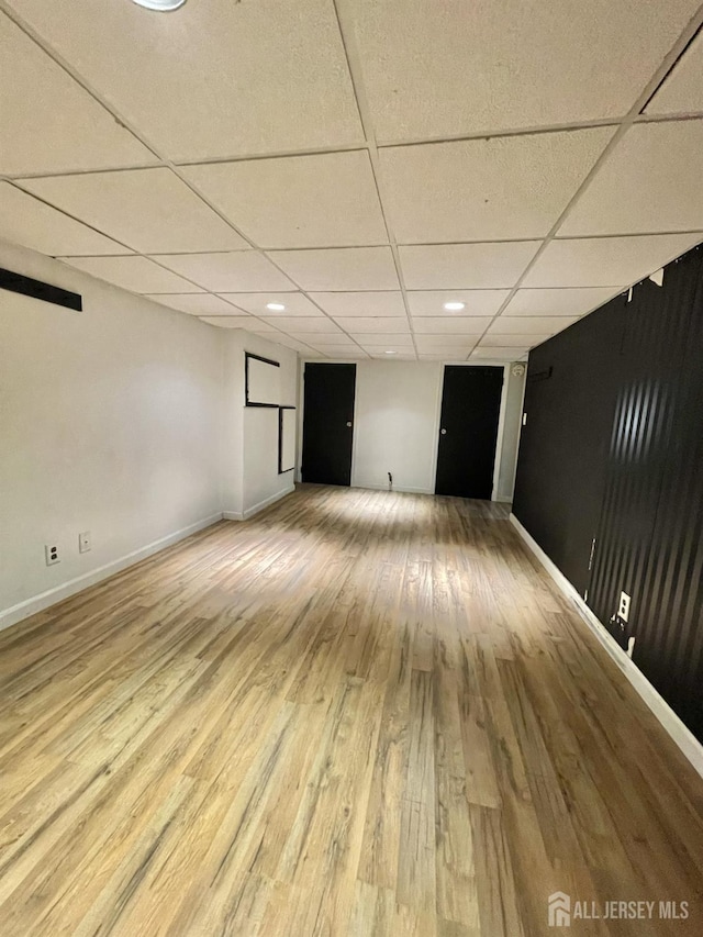 1211 S 9th St, South Plainfield, NJ 07080 - finished below grade area featuring a drop ceiling, wood finished floors, baseboards, and recessed lighting