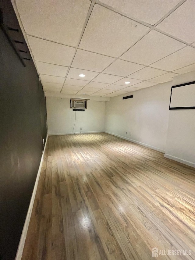 1211 S 9th St, South Plainfield, NJ 07080 - unfurnished room with hardwood / wood-style floors, baseboards, a paneled ceiling, recessed lighting, and a wall mounted air conditioner