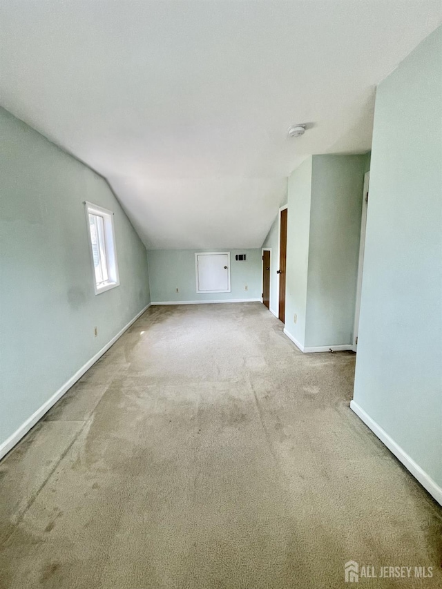 1211 S 9th St, South Plainfield, NJ 07080 - additional living space featuring vaulted ceiling, carpet, and baseboards