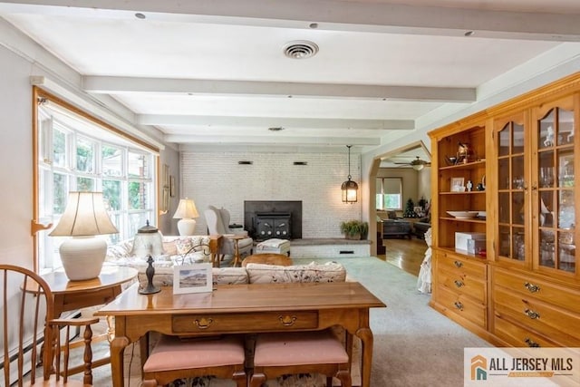 57 Jensen St, East Brunswick, NJ 08816 - living area with healthy amount of natural light, beam ceiling, ceiling fan, and carpet