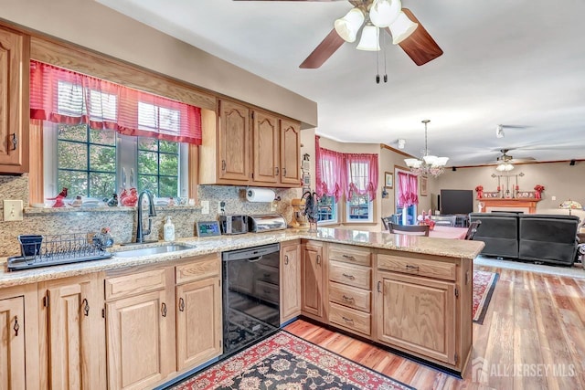 kitchen with dishwasher, a ceiling fan, a peninsula, and light brown cabinetry
