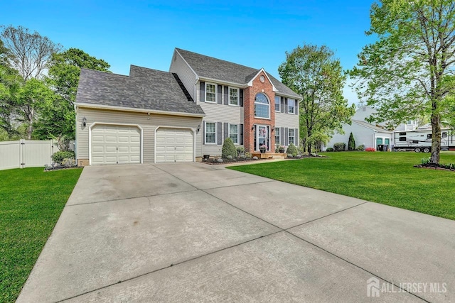 colonial-style house featuring an attached garage, driveway, a gate, and a shingled roof