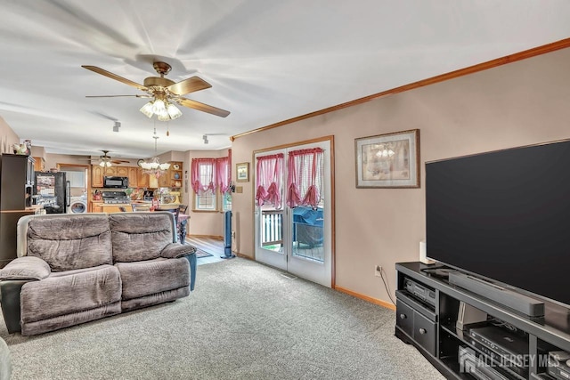 living room featuring ceiling fan, light carpet, baseboards, and crown molding