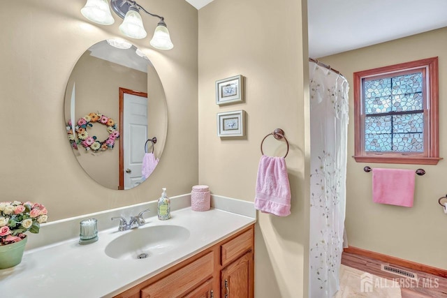 bathroom featuring vanity and a shower with curtain