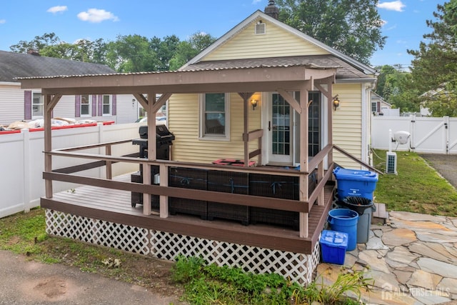 1775 W 5th St, Piscataway, NJ 08854 - rear view of house with a gate, a fenced backyard, and a wooden deck