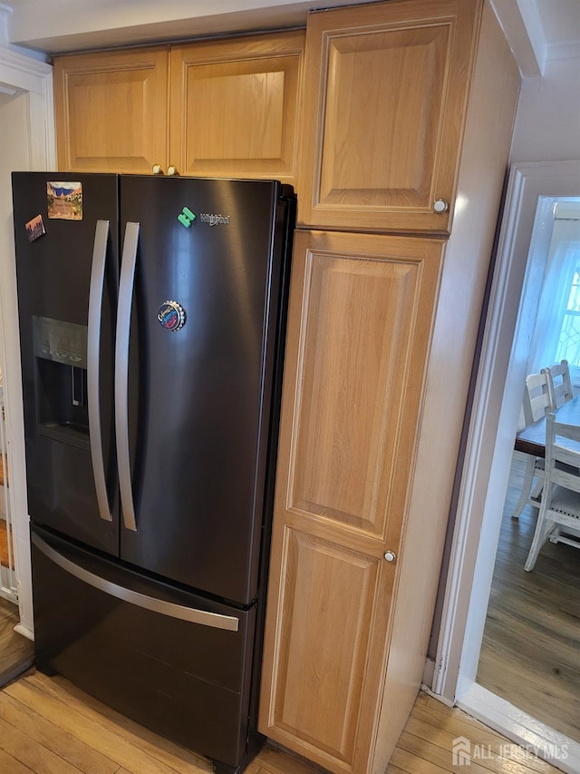 72 High St, Perth Amboy, NJ 08861 - kitchen with refrigerator with ice dispenser, light wood-style flooring, and light brown cabinetry