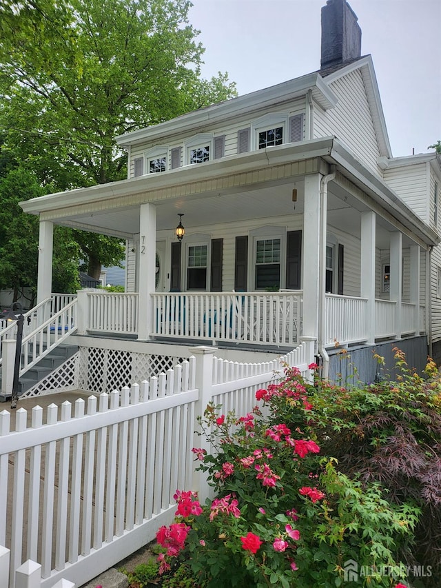 72 High St, Perth Amboy, NJ 08861 - view of front facade featuring covered porch and a chimney