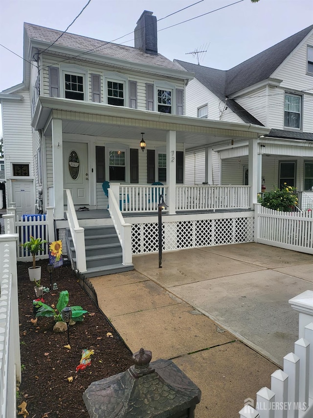 72 High St, Perth Amboy, NJ 08861 - view of front facade with a porch and a chimney