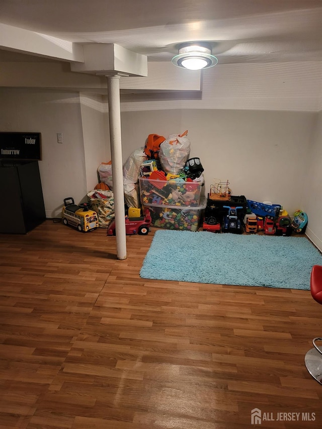 72 High St, Perth Amboy, NJ 08861 - finished basement featuring wood finished floors