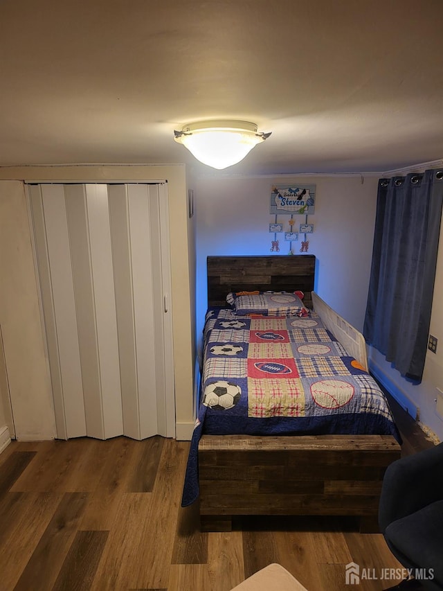 72 High St, Perth Amboy, NJ 08861 - bedroom featuring wood finished floors