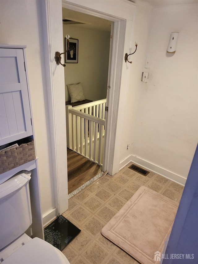 72 High St, Perth Amboy, NJ 08861 - bathroom featuring toilet, tile patterned floors, and baseboards