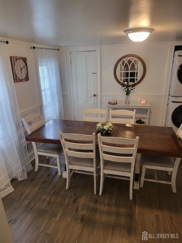72 High St, Perth Amboy, NJ 08861 - dining room with estacked washer and dryer and wood finished floors