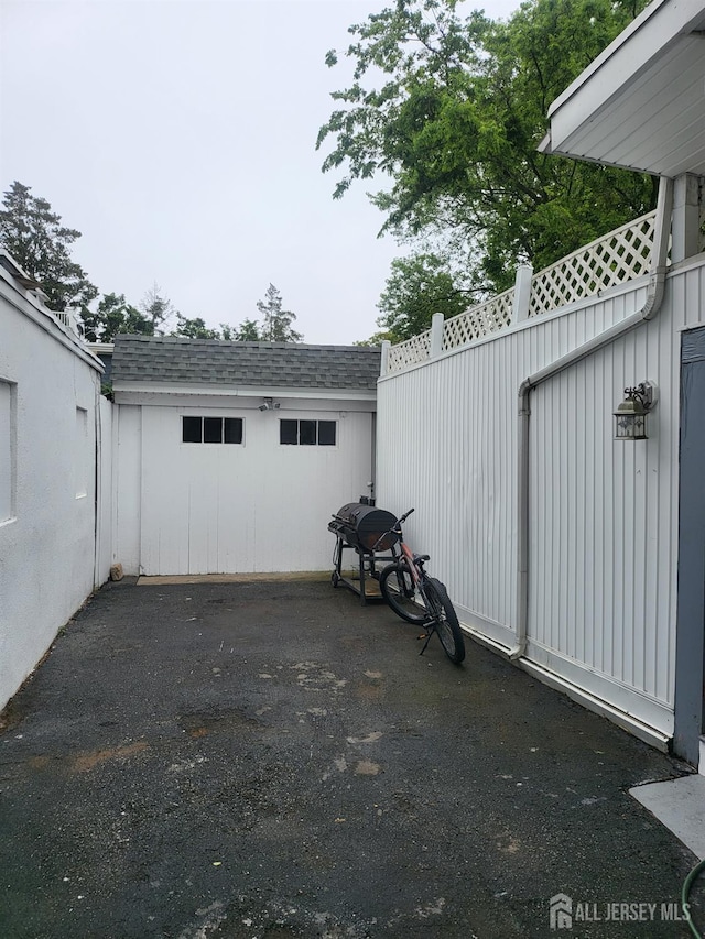 72 High St, Perth Amboy, NJ 08861 - view of car parking with a garage and a storage unit