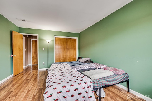 bedroom with light hardwood / wood-style flooring