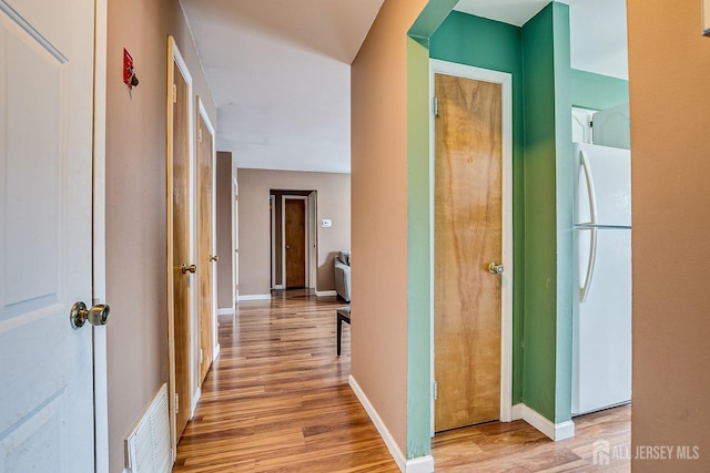 hallway featuring light wood-type flooring