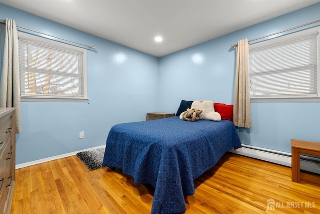 2291 Morrison Ave, Union Twp, NJ 07083 - bedroom with wood finished floors, recessed lighting, baseboards, and a baseboard radiator