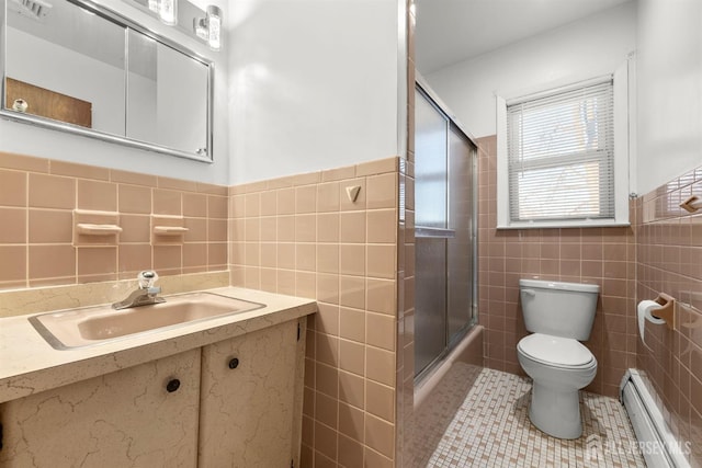 2291 Morrison Ave, Union Twp, NJ 07083 - full bath with a baseboard heating unit, tile walls, toilet, vanity, and tile patterned flooring