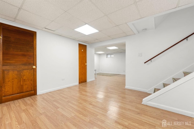 2291 Morrison Ave, Union Twp, NJ 07083 - finished basement with light wood finished floors, a paneled ceiling, stairway, and baseboards